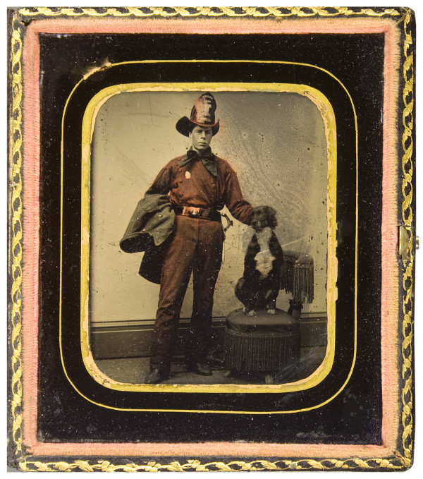 Striking red-tinted sixth-plate tintype of Fireman and his dog (1)